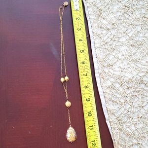 Golden necklace with golden pendant